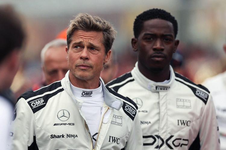 Brad Pitt and a race car driver celebrating a win at the Abu Dhabi Grand Prix.