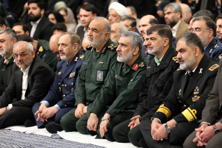 Iranian military officials seated together.