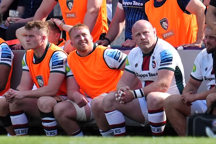 Leicester Tigers rugby players on the bench.