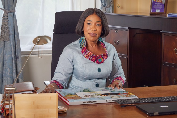 Shirley Botchwey sitting at her desk at Marlborough House.