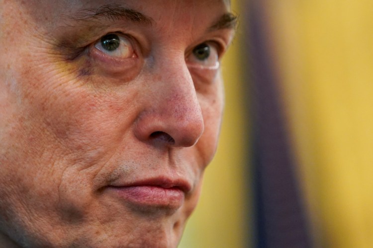 Close-up of Elon Musk with a black eye at a White House press conference.