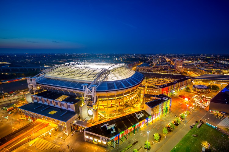 Aerial view of Johan Cruyff Arena at night.