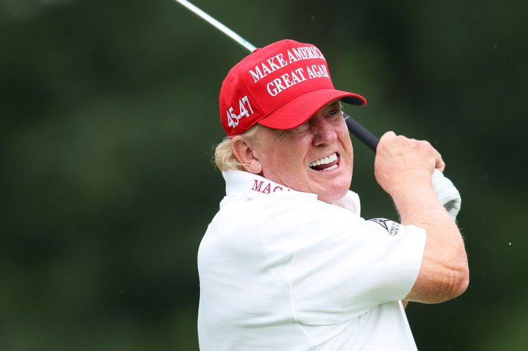 Former President Donald Trump golfing at the LIV Golf Invitational.