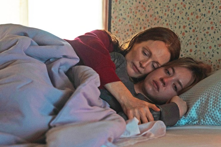 Still from Echo Valley, showing two women embracing in bed.