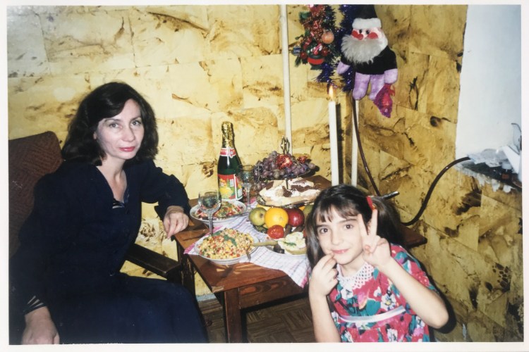 Photo of Lana and Natalya Estemirova at a celebratory meal.