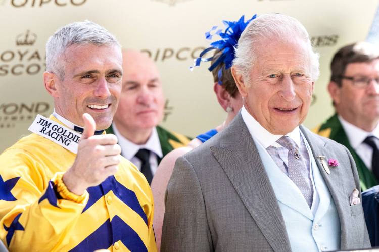 Jockey Paul Mulrennan with King Charles III after winning the King Charles III Stakes at Royal Ascot.