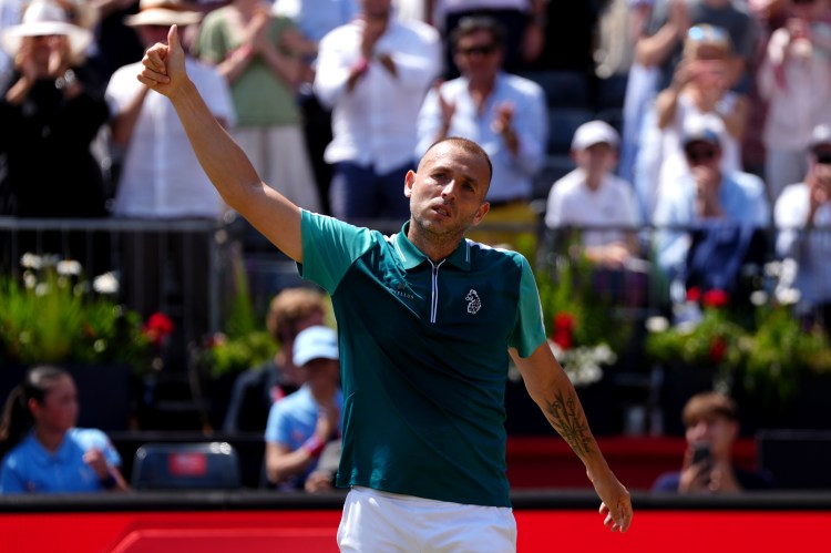 Evans celebrates after he brushed aside Tiafoe, the world No13