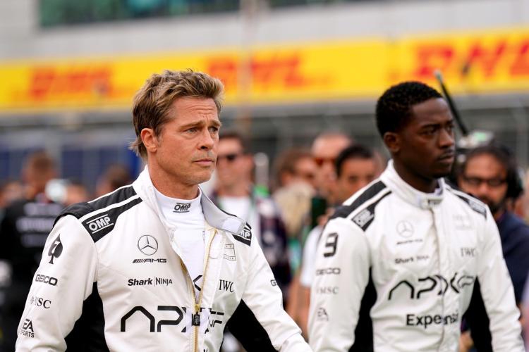 Brad Pitt and Damson Idris at a Formula 1 event.