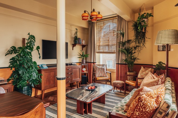 Living room with mid-century modern furniture and decor.