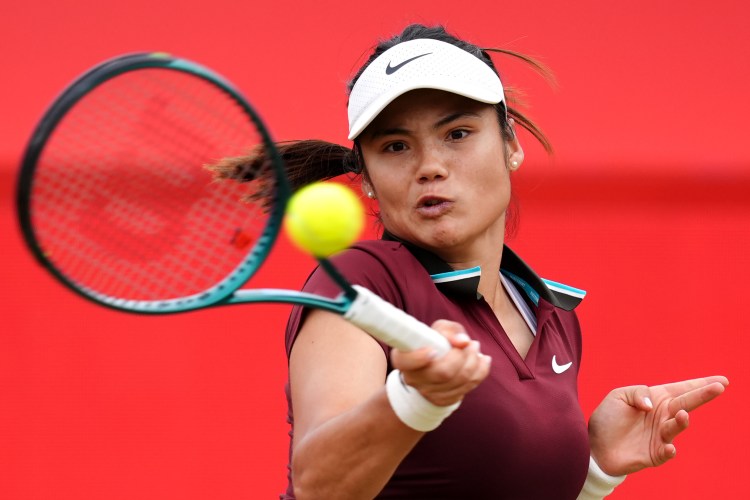 Photo of Emma Raducanu playing tennis.