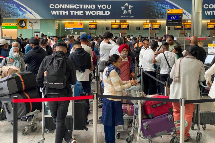 Crowded Heathrow Terminal 2 departures.