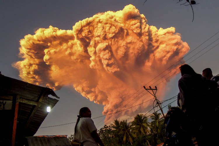 Villagers watching Mount Lewotobi Laki-Laki erupt.