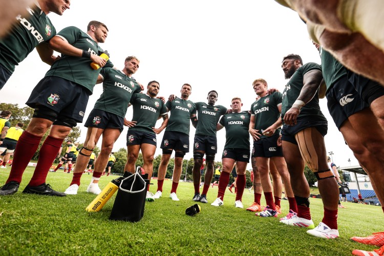 British and Irish Lions rugby team huddling.