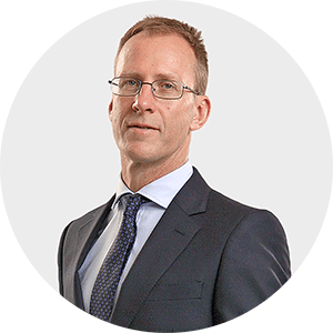 a man in a suit and tie is wearing glasses
